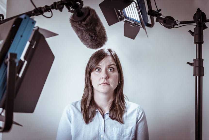 Woman looking scared in front of camera